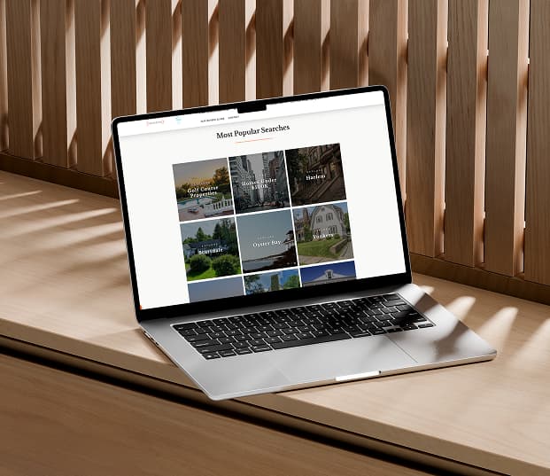 A laptop showing a real estate website