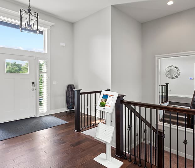 Front entrance way of a house with a kiosk for Open House info