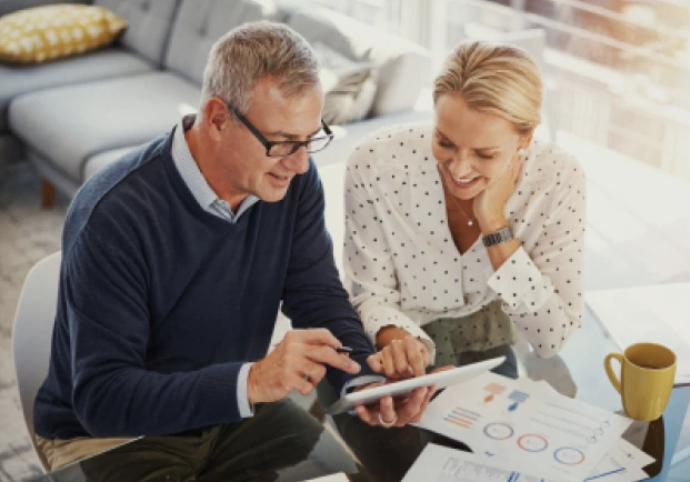 A man and woman reviewing their finances.